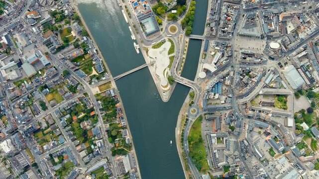 Namur, Belgium. Arrow at the confluence of the Sambre and Meuse rivers. Drone footage, HEAD OVER SHOT with rotation
