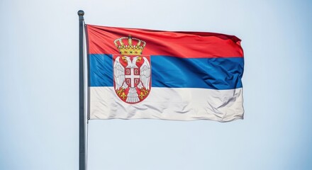 Fototapeta premium Serbia Flag Waving in Bright Daylight
