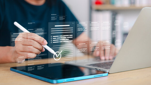 Professional reviewing digital documents and online forms on tablet and laptop. Concept of e-signature, document approval, online application, compliance, and paperless workflow management.