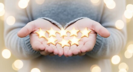 Person Holding Golden Stars in Hands.