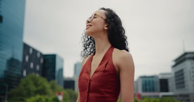 Thinking, business and woman with smile outdoor for real estate, planning and urban development. Thoughts, female realtor and glasses with vision, reflection and daydreaming for expansion opportunity