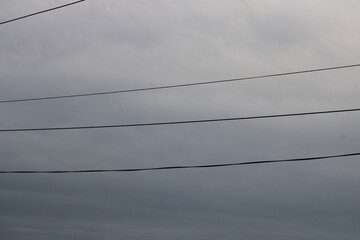 wires against a cloudy sky,