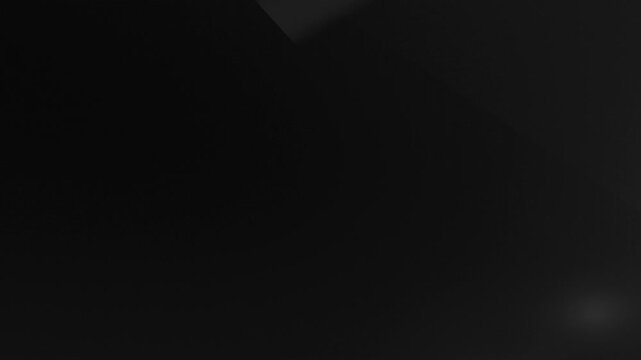 A dark gradient background image with subtle texture and soft, blurred points of light