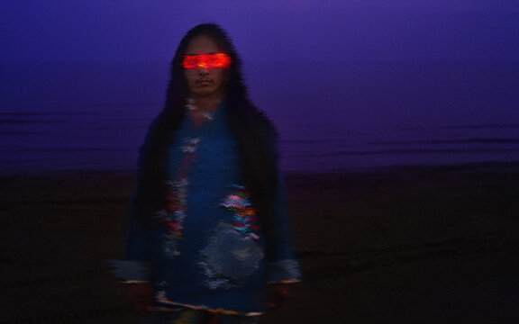 Man wearing VR glasses outdoors at night in cyberpunk setting