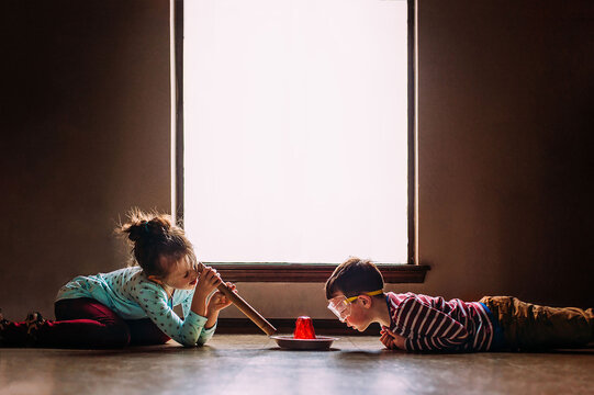 Two Children Observing Science Experiment