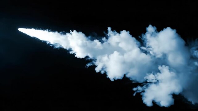 Smoke trails form with varying motion densities concept. White smoke trail against black background creating dynamic cloud shapes with dramatic lighting effect