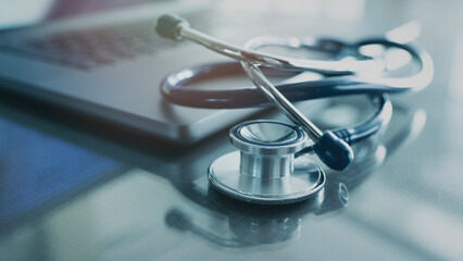Doctor table with computer and stethoscope