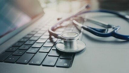 Doctor table with computer and stethoscope