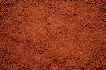 Rough Red Clay Plaster Texture. High-resolution close-up of a rustic red clay or terracotta textured wall, ideal for background design and earthy architectural concepts.