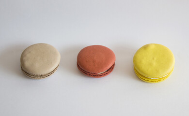 Sweet colorful macarons isolated on white background. 