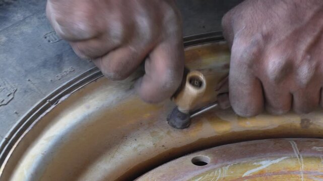 Tire Valve Installation with Integrated Pressure Gauge Check