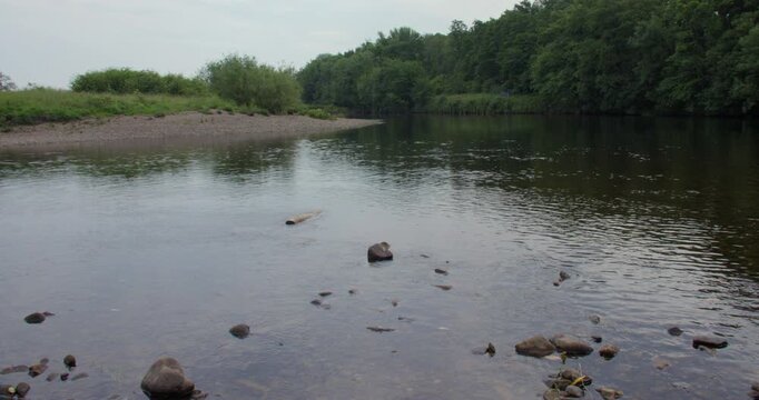 Extra Wide shot looking down the river Lune with a rocky shoreline. at Brookhouse