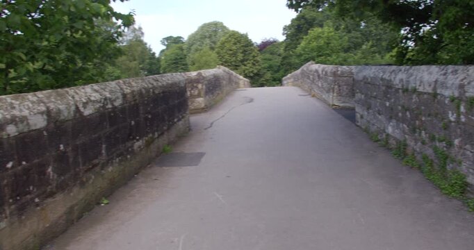 Wide panning shot looking across devils bridge at Kirkby Lonsdale, North Yorkshire