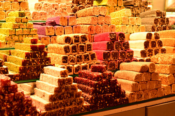 variety of Turkish traditional lokum sweet delight with Turkish coffee in cups, tea in tulip glass and fresh fruits