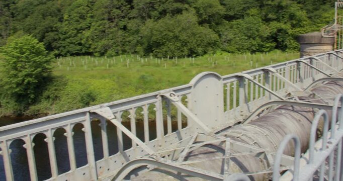 wide panning shot looking up the river Lune from the Thirlmere aqueduct waterworks,