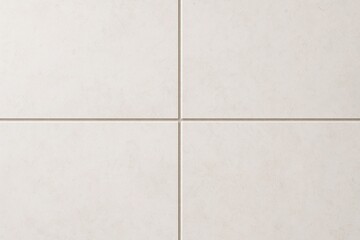 Fototapeta premium A close-up view of square, light cream-colored tiles with a subtle textured surface, evenly spaced grout lines creating a clean and modern aesthetic.