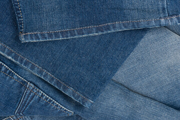 Fototapeta premium Blue jeans denim texture as a background. Top view.