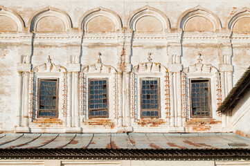 Windows with arches and stucco at the facade of Resurrection Cathedral of Derevyanitsky monastery in Veliky Novgorod surroundings