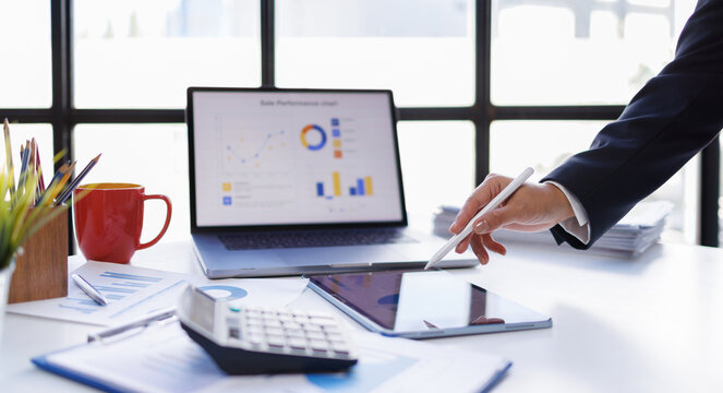 Analyst woman working with information database to analyze marketing and sales data. Business analytics dashboard with charts, metrics, and KPIs concept.

