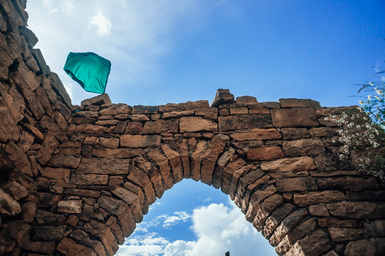 beautiful stone arch in the ruins of the abandoned ancient village of Gamsutl, Dagestan