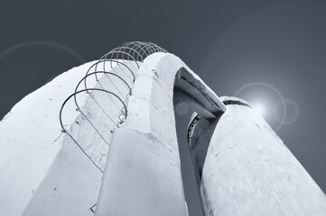 Stairs made of concrete and rebar, leading up to the column. Futuristic urban background in cold futuristic tones with stylized cosmic reflected lights