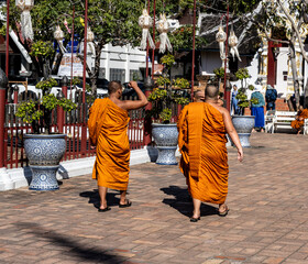 Separate fragments of a decorated Buddhist temple in Thailand on a sunny day