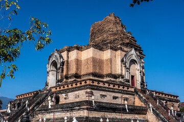 Separate fragments of a decorated Buddhist temple in Thailand on a sunny day