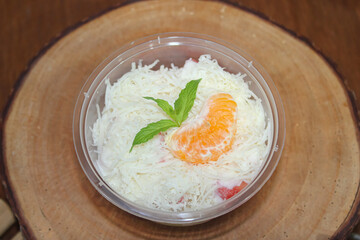 Top View Fresh Fruit Salad with Shredded Cheese and Mandarin Orange