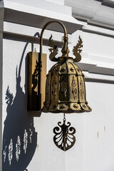 Separate fragments of a decorated Buddhist temple in Thailand on a sunny day