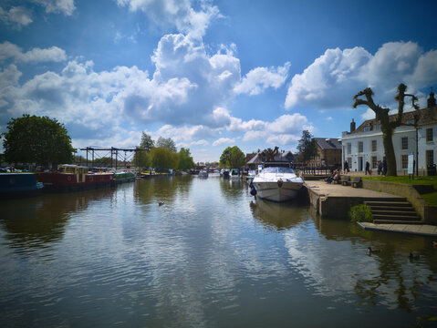 The Cambridgeshire City of Ely, Ship of the Fens, from the river in Spring under a bright blue sky.