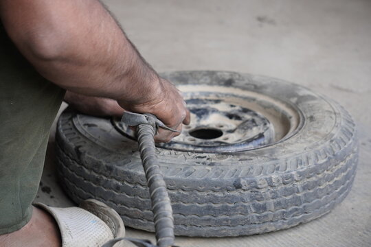 Manual Tire Inflation with Air Compressor Nozzle