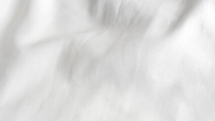 Obraz premium Close-up of textured white fabric with soft folds and creases