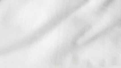 Obraz premium Smooth white fabric texture with subtle shadows and folds for design use