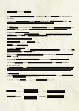 Censored legal contract with redacted confidential information on paper