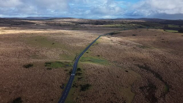 Spectacular view from above of road cutting through Dartmoor Devon