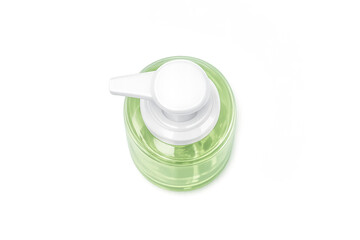 Top view of green liquid soap dispenser with minimalist design on gradient background