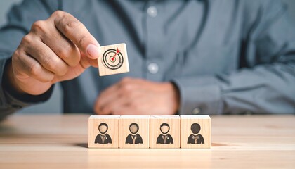 Hand places target block atop diverse people cubes