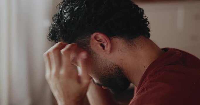 Frustrated, upset and man with stress in home, overthinking and disappointment for financial crisis. Poor money management, anxiety or person with regret for future security, bankrupt and overwhelmed