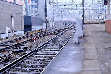 Fototapeta premium Complex railway switches and tracks at a station. Functional beauty of Japanese rail infrastructure.