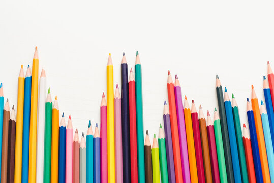 color pencils background. Colored pencils on a white background. Background of multicolored pencils.