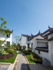 Obraz premium Stone Garden Path Between Traditional Chinese Houses