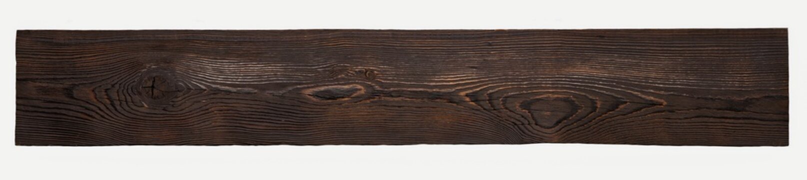 A single dark brown wood plank isolated on a white background. The detailed, rustic texture shows the natural grain and knots. Minimalist studio shot, perfect for backgrounds or banners