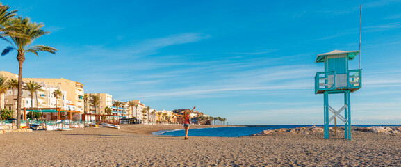 Happy woman tourist in Spain, costa tropical, Andalusia. Holidays on coast of Spain, Torrenueva, Malaga and Granada province © M.studio