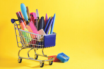 Shopping cart, various school supplies and copy space.