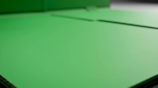 Open black portfolio with vibrant green interior, showing layered pages