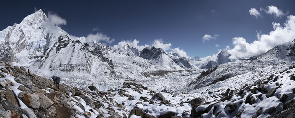 A Vast Panoramic View of Snowy Himalayan Range, Featuring Khumbu Glacier with Adventurous Trekkers on Trail to Mount Everest Base Camp. Nepal