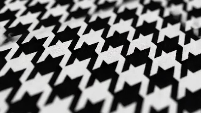 Blurred black and white houndstooth pattern with shallow depth of field