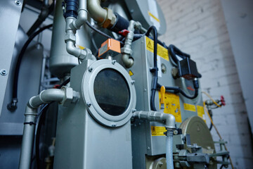 A machine with yellow warning signs attached to it for safety