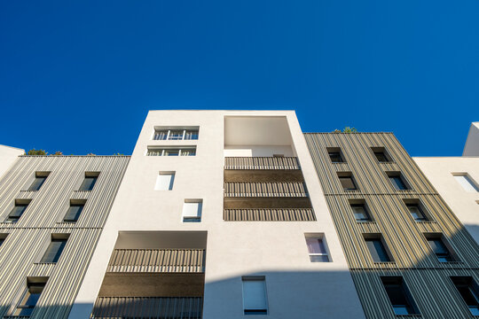 Modern apartment architecture facade with balconies in Port Marianne Montpellier France shot in strong perspective against open sky