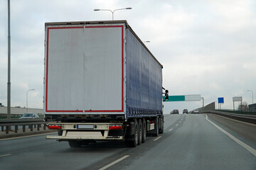 Heavy Truck Transports Cargo on a Highway